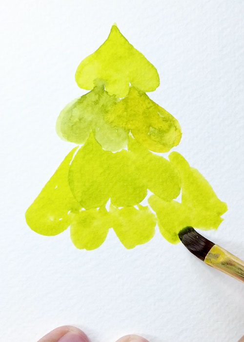 first light yellow-green layer of an easy watercolor christmas tree